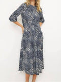 The Eleanor Smocked Midi Dress in Grey Leopard